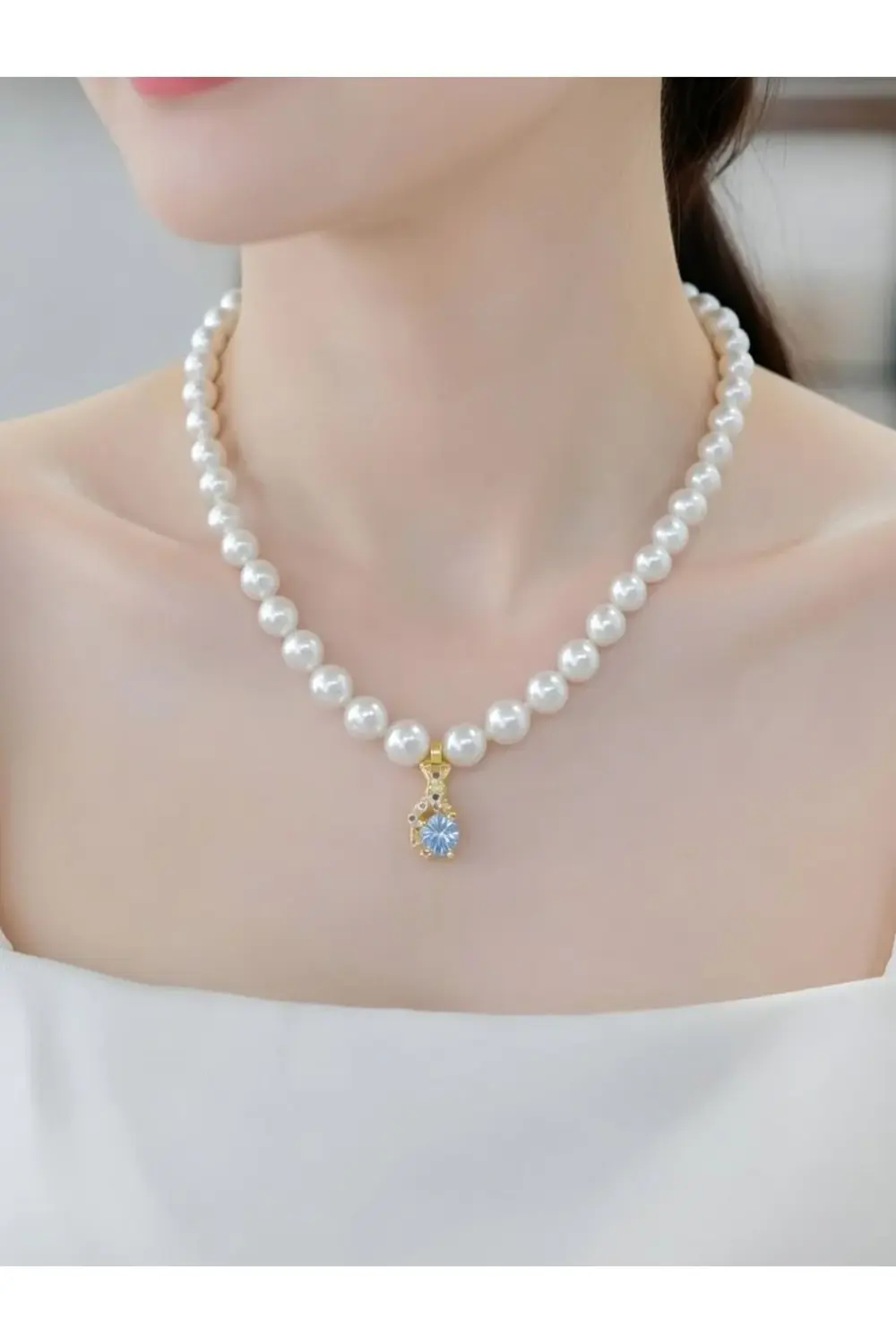 Çelik figürlü inci kolye