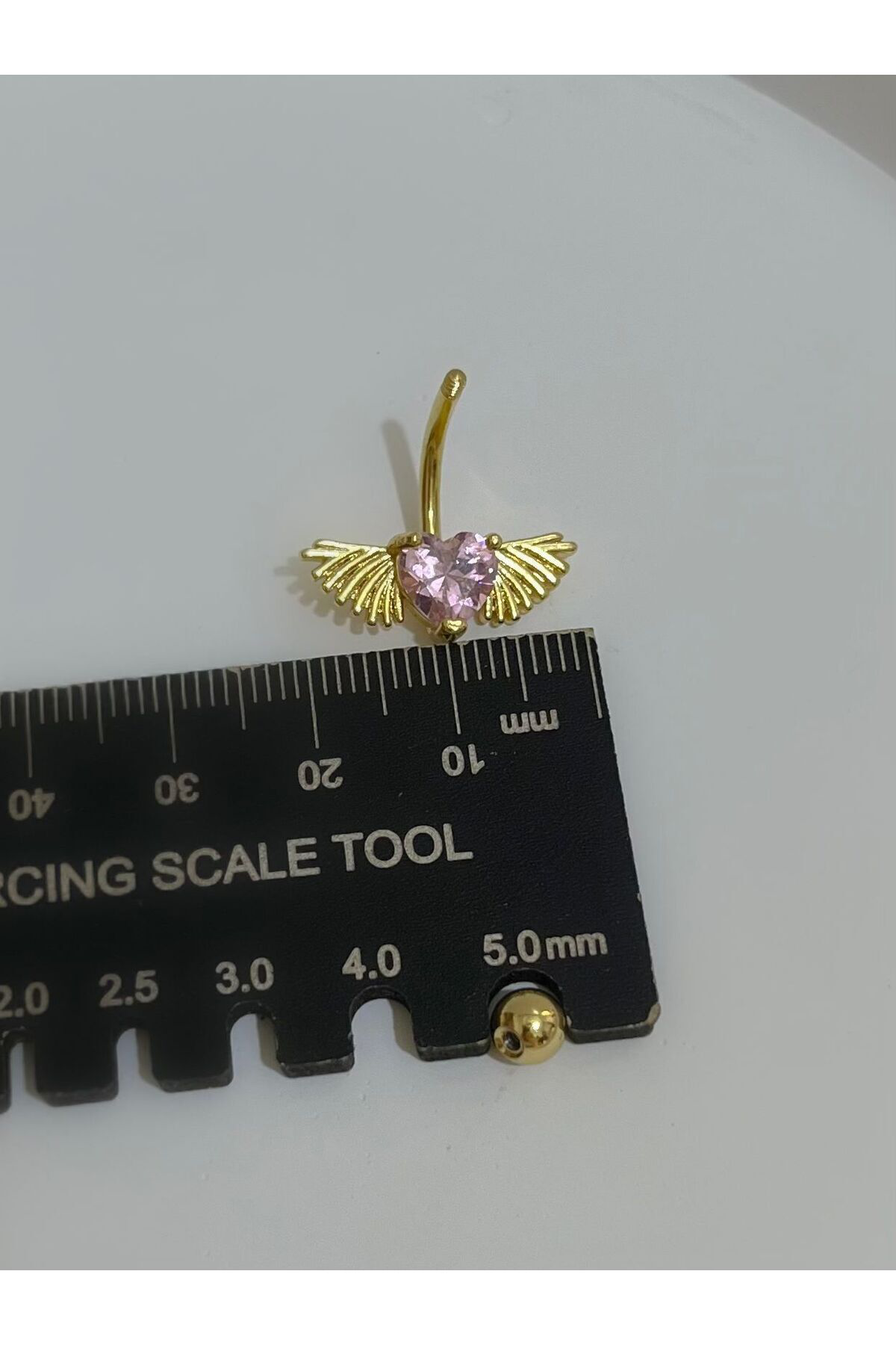 CERRAHİ ÇELİK PEMBE TAŞLI KALPLİ KANATLI GOLD RENK GÖBEK PİERCİNGİ Fiyatı, Yorumları ve Özellikleri