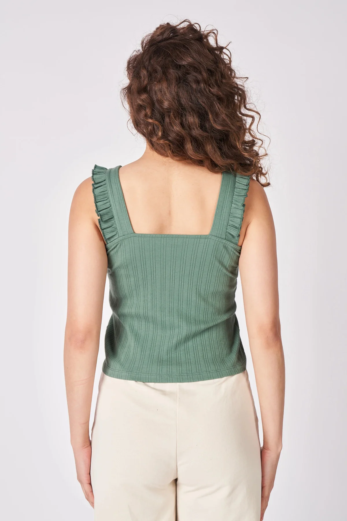 Kadın V Yaka Sıfır Kol Esnek Kumaştan Fırfırlı Bluz Mercan