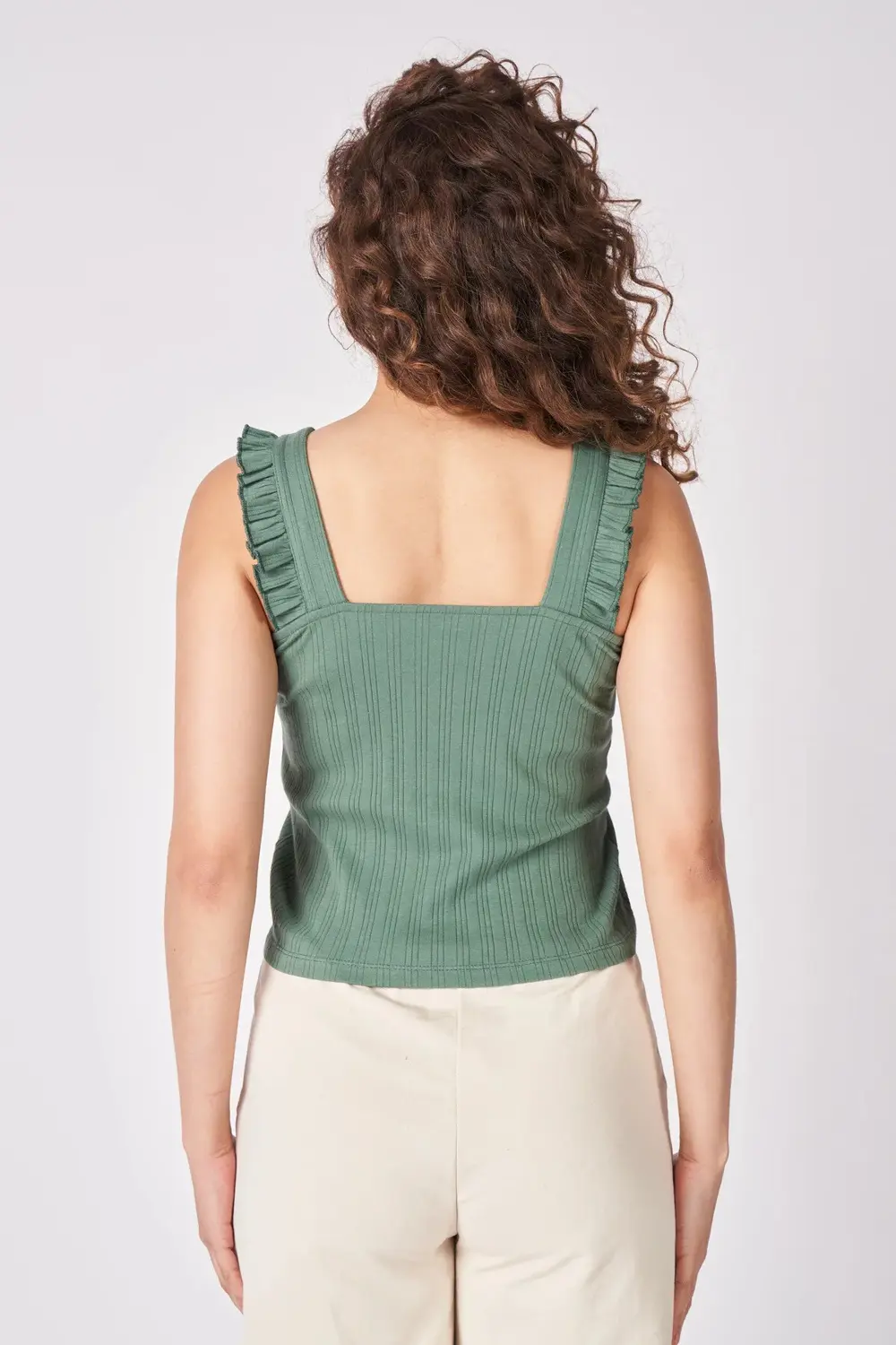 Kadın V Yaka Sıfır Kol Esnek Kumaştan Fırfırlı Bluz Taş