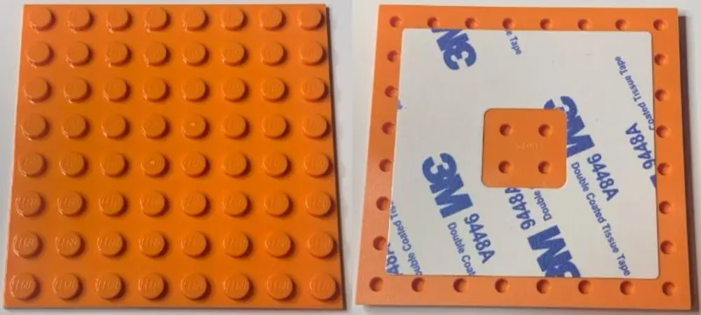 Lego 6396071 Plate, Modified 8 x 8 with Double-Sided Adhesive Tap Lego 6396071 Plate, Modified 8 x 8 with Double-Sided Adhesive Tap