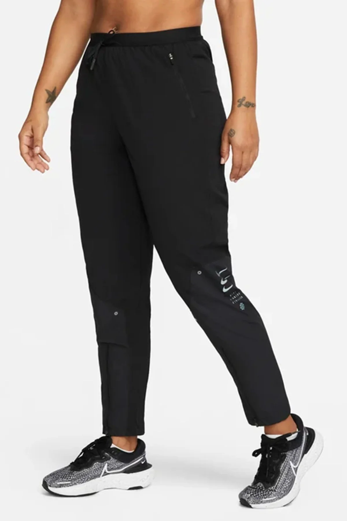 Nike Therma Fit Division Woven Womens Running Pant.Isı Düzenleyici Fermuar Cepli Kadın Koşu Eşofman Altı Siyah Nike Therma Fit Division Woven Womens Running Pant.Isı Düzenleyici Fermuar Cepli Kadın Koşu Eşofman Altı Siyah
